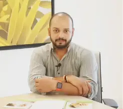 Murali Kartik testimonial graphic, former Indian cricketer seated indoors